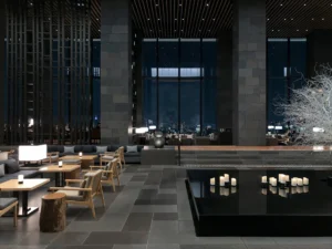 Spacious hotel lobby with tall windows and seating areas